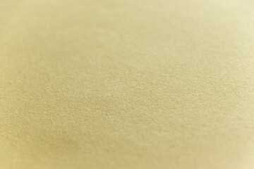 Fototapeta na wymiar 薄黄色の紙の表面