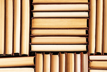 Hardback books heap in library, bookstore. Reading, education concept. Literature background. High quality photo