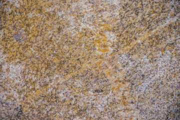 Stone gray textured background. Natural stone. The black background is a blank for the design. Uneven surface.