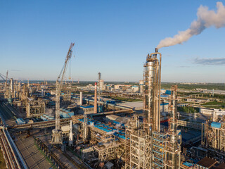 Fototapeta premium Aerial view of high fractional column in chemical plant.