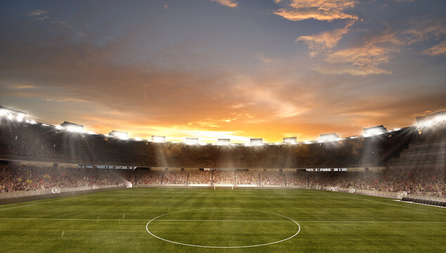 Sunset Above Empty Football Field With Flashlights And Dark Night Sky Background. Stadium With Filled Stands With Sports Soccer Fans.