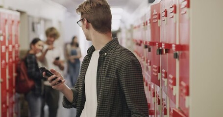 School, cyber bullying and smartphone, sad victim bullied by students in locker hallway. Depression, social anxiety and internet gossip, the pressure of being a high school teenager with technology.