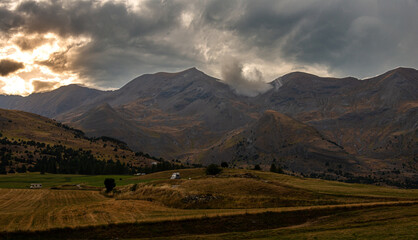 the col de festre ,in the deloluy area of France , with threatening storm clouds on the moutains