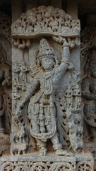The Beautiful Sculpture of Lord Krishna Holding a Mountain, Lakshminarsimha Temple, Javagal, Hassan, Karnataka, India.