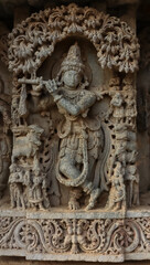 The Beautiful Sculpture of Lord Krishna Playing a Flute, Lakshminarshimha Temple, Javagal, Hassan, Karnataka, India.