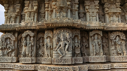 The Beautiful Carving Sculptures of Hindu God and Goddess on the Temple of Shri Lakshminarshimha Temple, Javagal, Hassan, Karnataka, India. - obrazy, fototapety, plakaty
