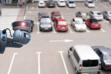 Video surveillance camera installed on a vehicle parking.