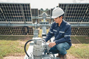 Technicians are checking the operation of the solar power plant equipment so that the power generation can operate at full capacity. Alternative energy to conserve the world's energy