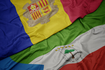 waving colorful flag of equatorial guinea and national flag of andorra.