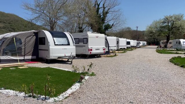 Caravans in a row in the campsite, Caravan Camping Site In Nature, Travel Trailers in the Camping ground. Agva, Turkey. 
