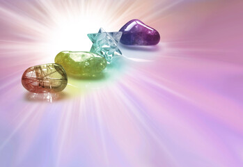 Crystal healing memo template background - lilac pink light burst with three tumbledstones and a merkabah with copy space below ideal for a business card, invitation, coupon or gift voucher 
