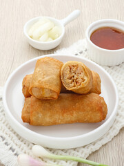 Lumpia or lunpia, traditional snacks from Semarang, Central Java, Indonesia. Traditional spring rolls contain stir-fried bamboo shoots (rebung), eggs, and chicken or shrimp. 
