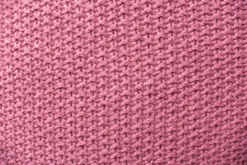 Fototapeta premium Knitted hemp fabric. Pink woven background.