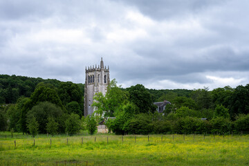 Fototapeta na wymiar Le Bec-Hellouin abbey tower in spring, Normandy, France