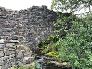 Old stone ruins surrounded by trees and countryside. Taken in Lancashire England. 