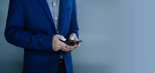 Close-up view of a businessman using a phone, empty space on the right.