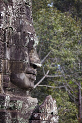 Fototapeta na wymiar The serenity of the stone faces of Bayon temple, Siem Reap, Cambodia