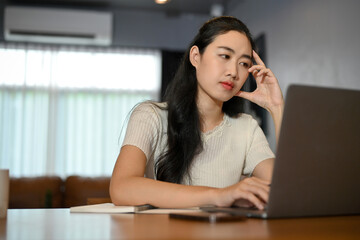 Fototapeta na wymiar Professional Asian female office pensively thinking about the business strategy plan