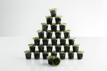 Closeup shot of wheatgrass juice isolated on a white background