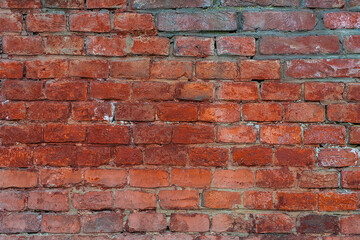 Old brick wall. Textured surface. Broken wall. Wall from red bricks.