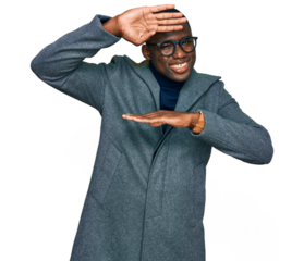 Young african american man wearing business clothes and glasses smiling cheerful playing peek a boo with hands showing face. surprised and exited