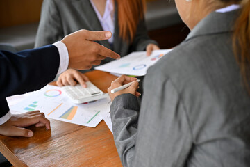 Asian businesswoman in formal suit is in the financial meeting with her boss.