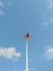 A Light Pole with Blue Sky and Clouds. Beautiful View In A Day. Perfect For Background