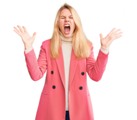 Young beautiful blonde woman wearing elegant clothes celebrating mad and crazy for success with arms raised and closed eyes screaming excited. winner concept