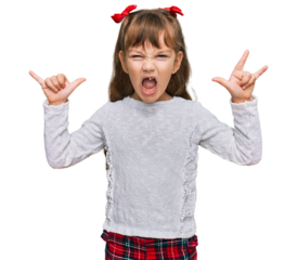 Little caucasian girl kid wearing casual clothes shouting with crazy expression doing rock symbol with hands up. music star. heavy concept.