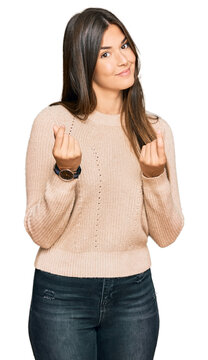 Young Brunette Woman Wearing Casual Winter Sweater Doing Money Gesture With Hands, Asking For Salary Payment, Millionaire Business