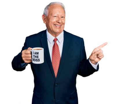 Senior business man with grey hair drinking from i am the boss coffee cup smiling happy pointing with hand and finger to the side - Powered by Adobe