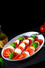 Tomato with mozzarella and basil