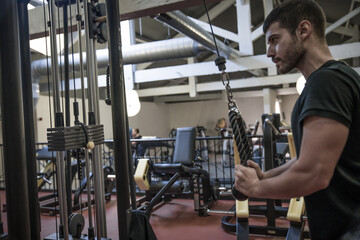 man exercising with dumbbells