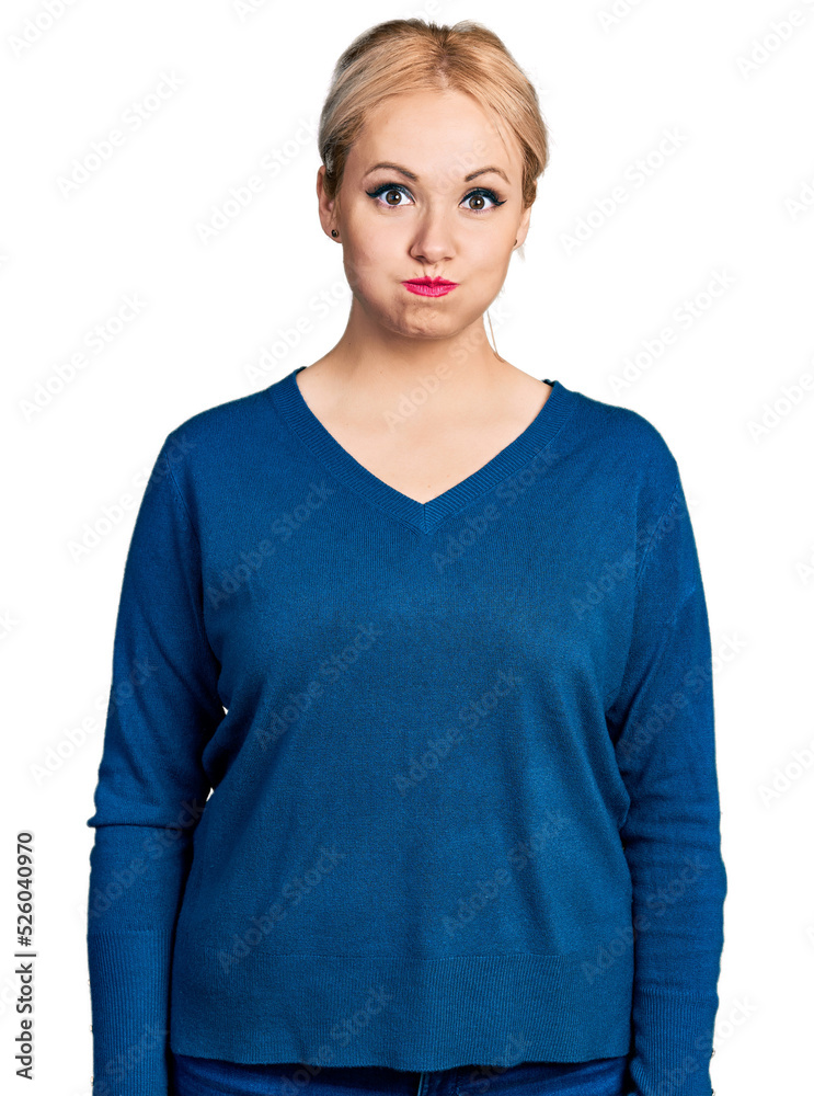 Canvas Prints young blonde woman wearing casual clothes puffing cheeks with funny face. mouth inflated with air, c