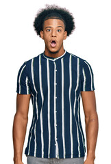 African american man with afro hair wearing casual clothes afraid and shocked with surprise expression, fear and excited face.