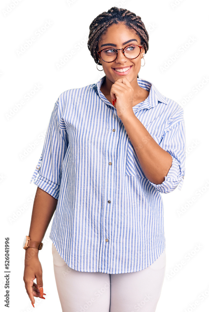 Canvas Prints Young african american woman with braids wearing casual clothes and glasses looking confident at the camera with smile with crossed arms and hand raised on chin. thinking positive.