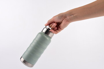 Hand holding cup cold storage. Tumbler glass cold store.