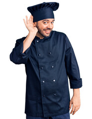 Young hispanic man wearing cooker uniform smiling with hand over ear listening an hearing to rumor or gossip. deafness concept.