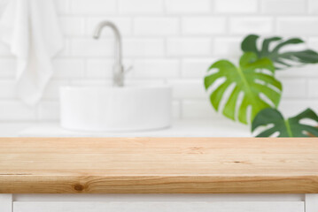 Classic wood texture table for product display before blurred bathroom