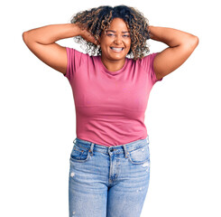 Young african american plus size woman wearing casual clothes relaxing and stretching, arms and hands behind head and neck smiling happy