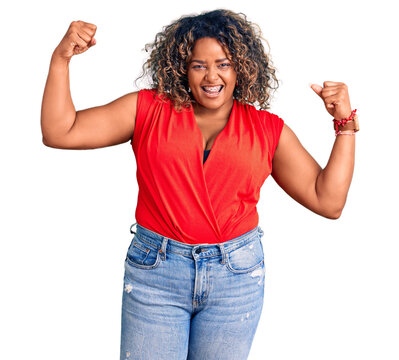 Young african american plus size woman wearing casual style with sleeveless shirt showing arms muscles smiling proud. fitness concept.