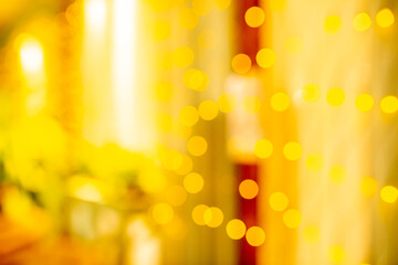 Blurred holiday background. Bokeh background of Christmas garlands. Beautiful New Year's home interior decorations.
