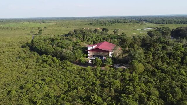 Rotating with a drone camera, around the Gajah Hospital, which is in the middle of the forest of Way Kambas Indonesia National Park.