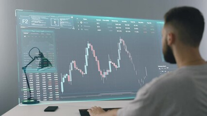 Futuristic concept of crypto trader man using hologram screen with stock data, future of virtual money