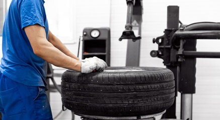 Banner professional mechanic changing tires. Closeup wheel of car