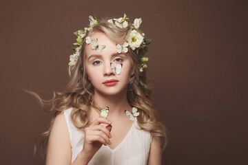 Beautiful woman with light hair and butterflys