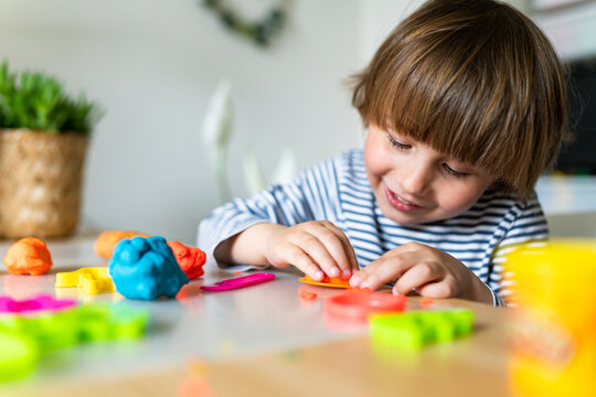 Toddler Child Playing With Modeling Compound Set At Home. Kid  Early Development, Creative Play