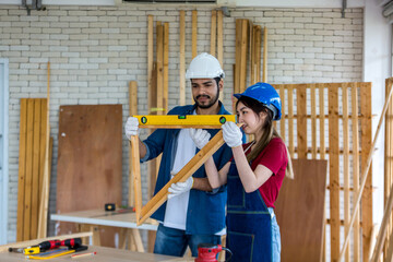 Carpenter working in carpentry shop. Carpenter working to making wood furniture in wood workshop 