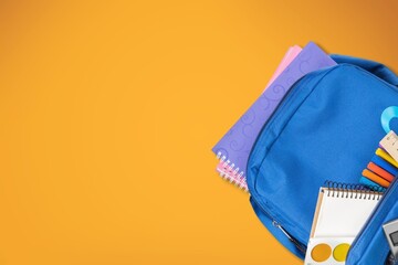 School backpack with colorful stationery. Back to school concept.