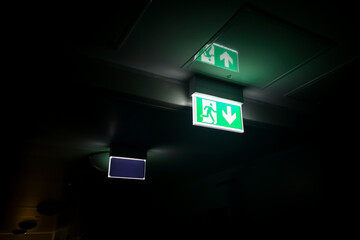 Illuminated evacuation board, safety sign in the corridor. safety and fire protection measures.